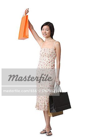 Young woman with shopping bags, portrait