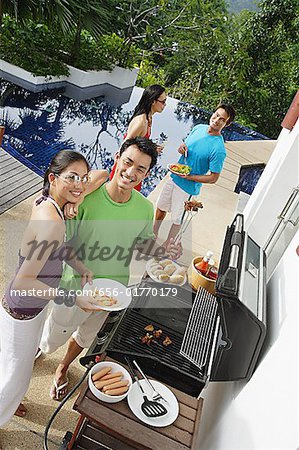 Couples at barbeque party