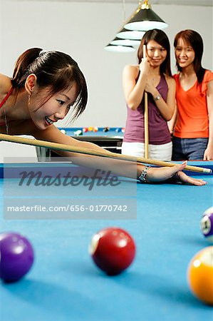 Women playing pool