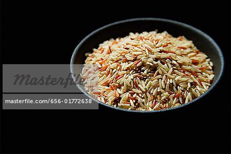 Still life of Bowl of rice against black background