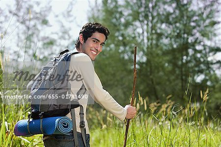 Young man hiking in the wilderness