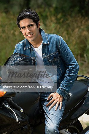 Young man riding motorbike