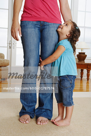 Girl Hugging Mother's Leg