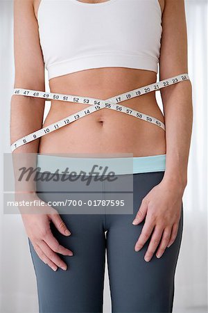 Woman's Stomach Wrapped with Measuring Tape