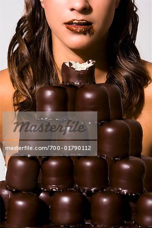 Woman Eating Pile of Chocolate