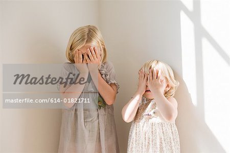 Girls playing hide and seek