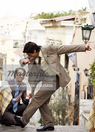 Two businessmen Greek dancing