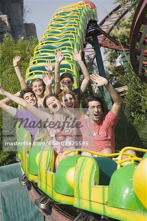 Teenagers on amusement park ride