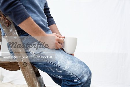 Painter Sitting on Ladder with Coffee