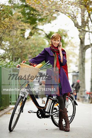 Woman with Bicycle on Cell Phone