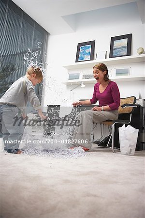 Woman and Child Making Mess in Home Office