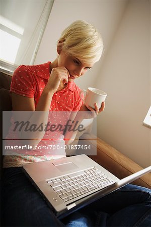 Woman Using Computer, Drinking Coffee