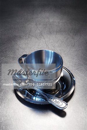 Still Life of Stainless Steel Espresso Cup and Saucer
