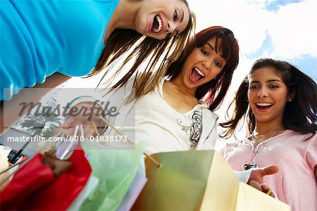 Girls Looking in Shopping Bags