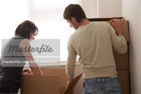 Couple with Boxes in New Home