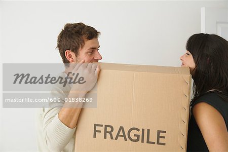 Couple Lifting Box Together