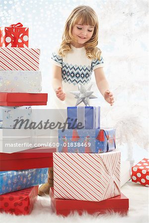 Girl Surrounded by Christmas Presents