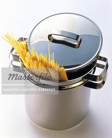 Uncooked Spaghetti in a Stainless Steel Pot