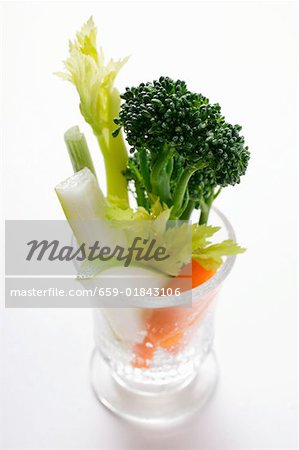 Celery, broccoli and carrots in glass