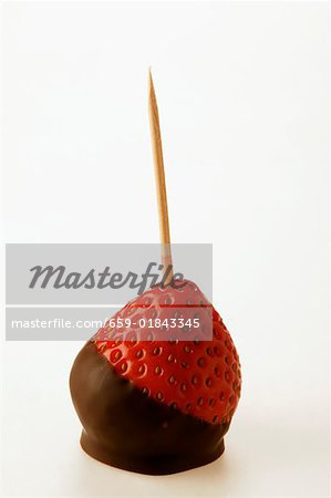 Chocolate-coated strawberry on toothpick