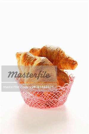 Croissants in pink bread basket