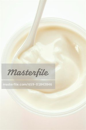 Yoghurt in pot with spoon