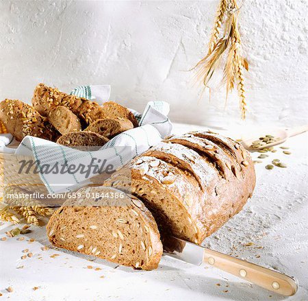 Sunflower seed bread, a slice cut bread rolls in bread basket