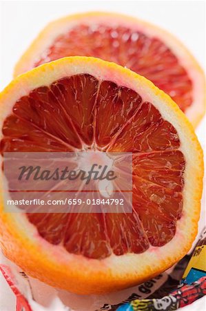 Blood orange halves on wrapping paper