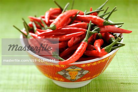 Red chili peppers in Asian bowl