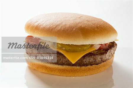 Cheeseburger with gherkin, onions and ketchup