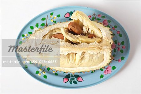 Durian (a quarter of a fruit) on colourful plate