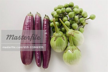 Green and purple baby aubergines