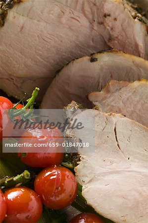 Roast pork with cherry tomatoes (close-up)