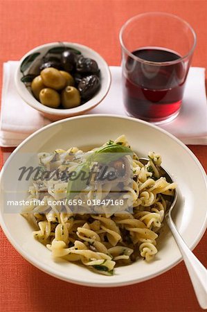 Fusilli with sardines & basil, olives, glass of red wine