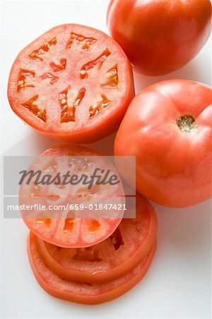 Tomatoes, whole, halved and slices