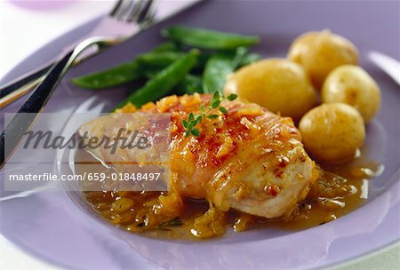 Chicken breast wrapped in ham with onions sauce, potatoes