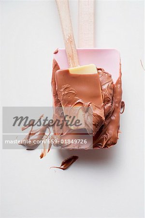 Mixing spoon with melted chocolate