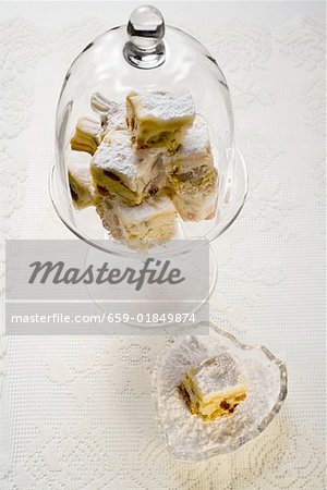 Fruit squares (with dried fruit) under glass dome
