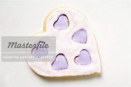 Heart-shaped biscuit with lilac and white icing