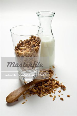 Muesli in a glass, carafe of milk beside it (2)