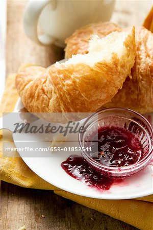 Croissant with jam for breakfast