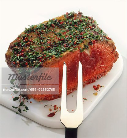 A piece of beef fillet with herb crust