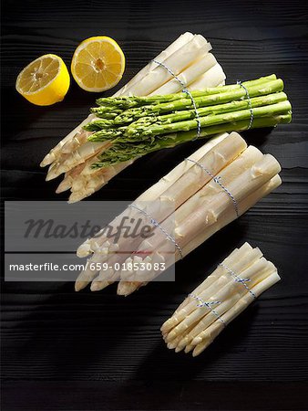 White asparagus in bundles with halved lemon