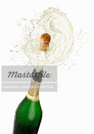 Cork flying out of a sparkling wine bottle