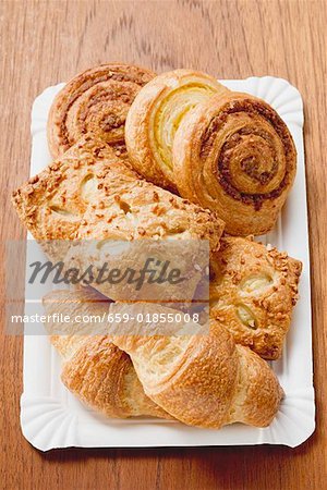 Assorted Danish pastries on a paper plate