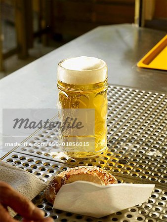 Freshly poured draught beer on bar counter