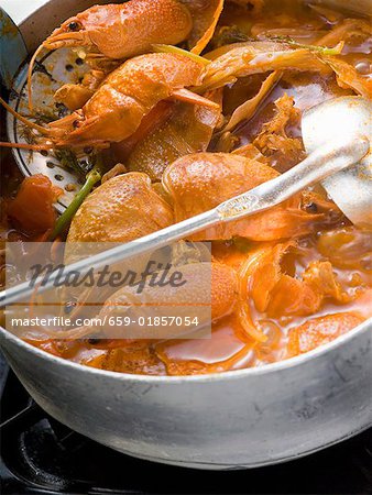 Crayfish stew in stew-pan on cooker