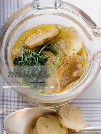 Pretzel soup with onions and deep fried parsley