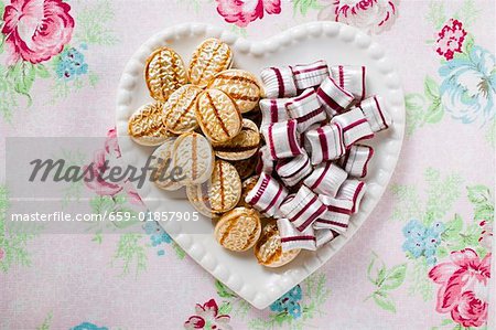 Two kinds of sweets on heart- shaped plate