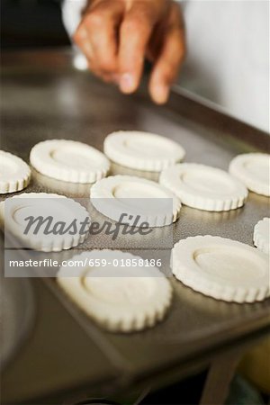 Laying tart cases on baking tray